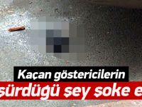 Kaçan göstericiler silah düşürdü